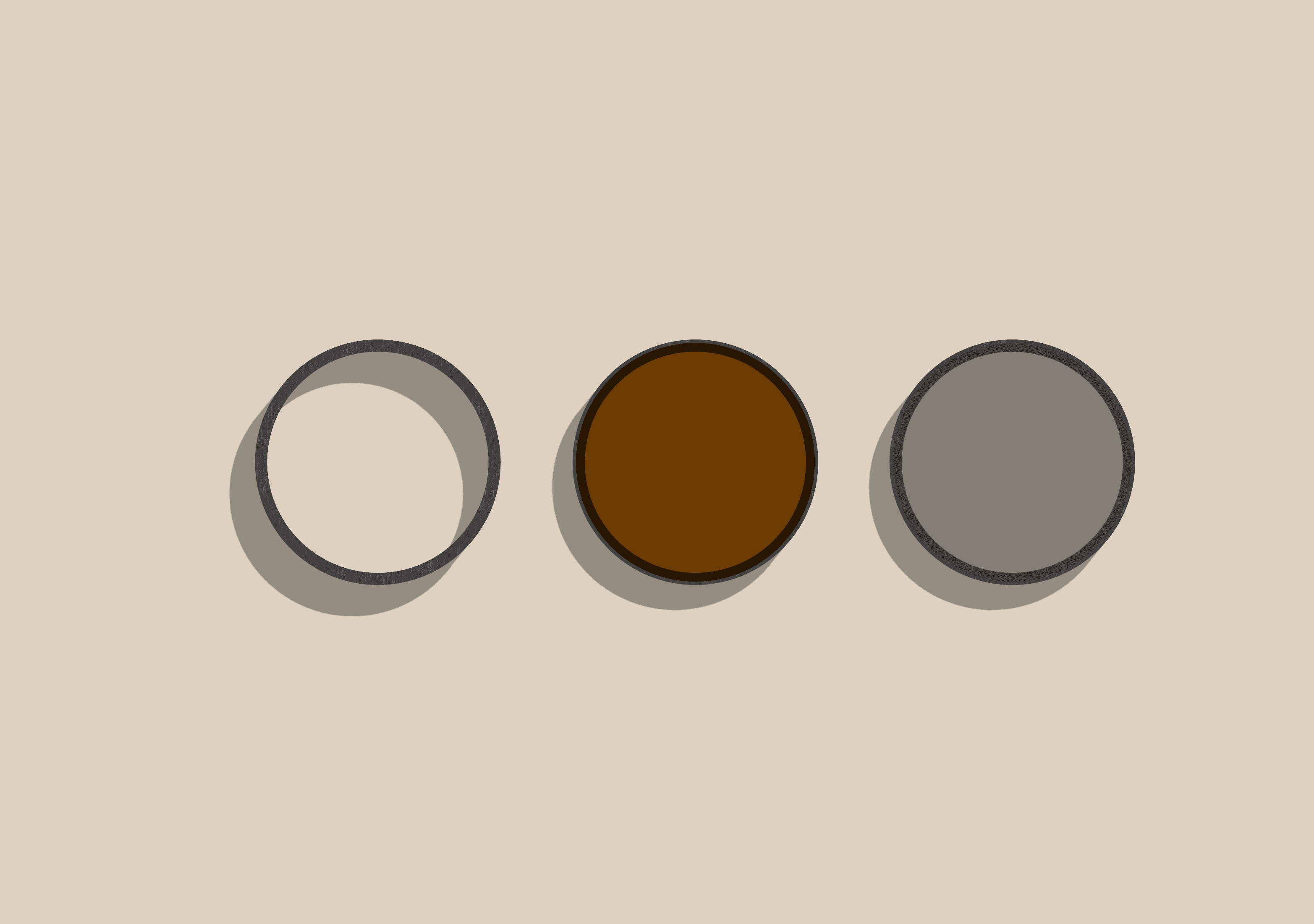 The MiLens press-fit ring, ND filter and circular polariser laid out in a row.